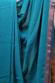 Teal Blue Plain Linen Saree With Green Tassels - SRTBPLS324