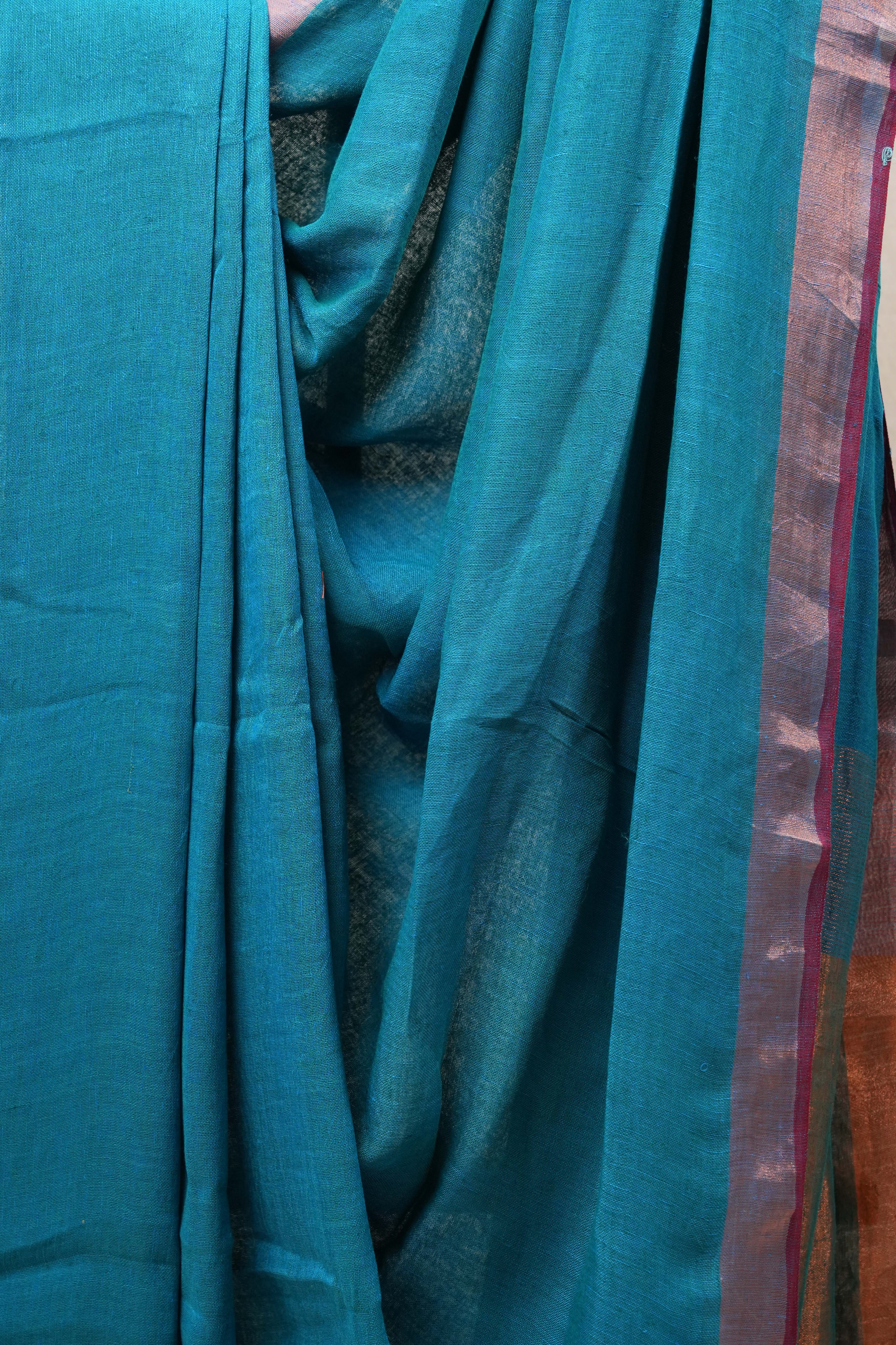 Teal Blue Plain Linen Saree With Green Tassels - SRTBPLS324