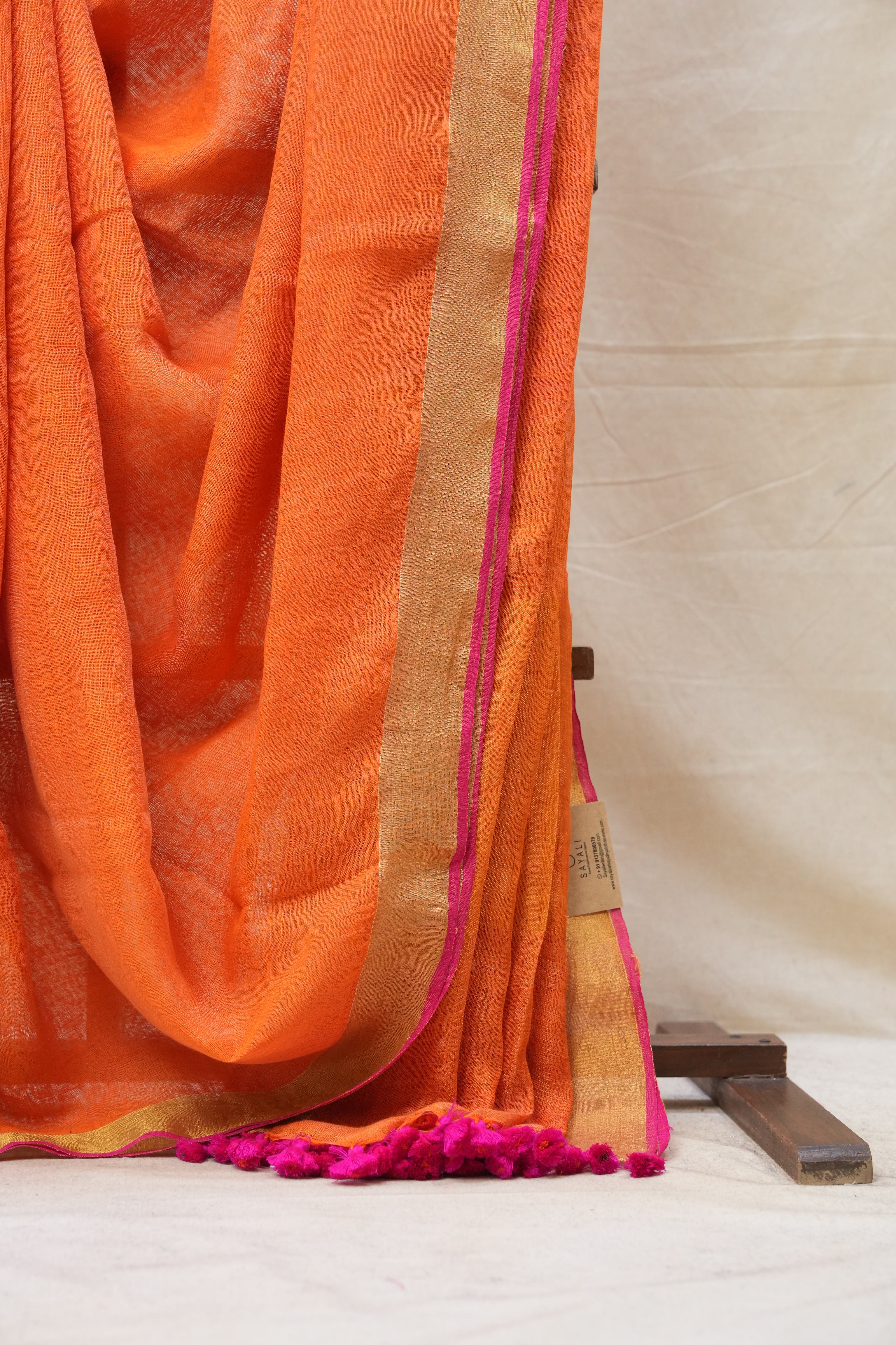 Orange Plain Linen Saree With Pink Tassels - SROPLS302