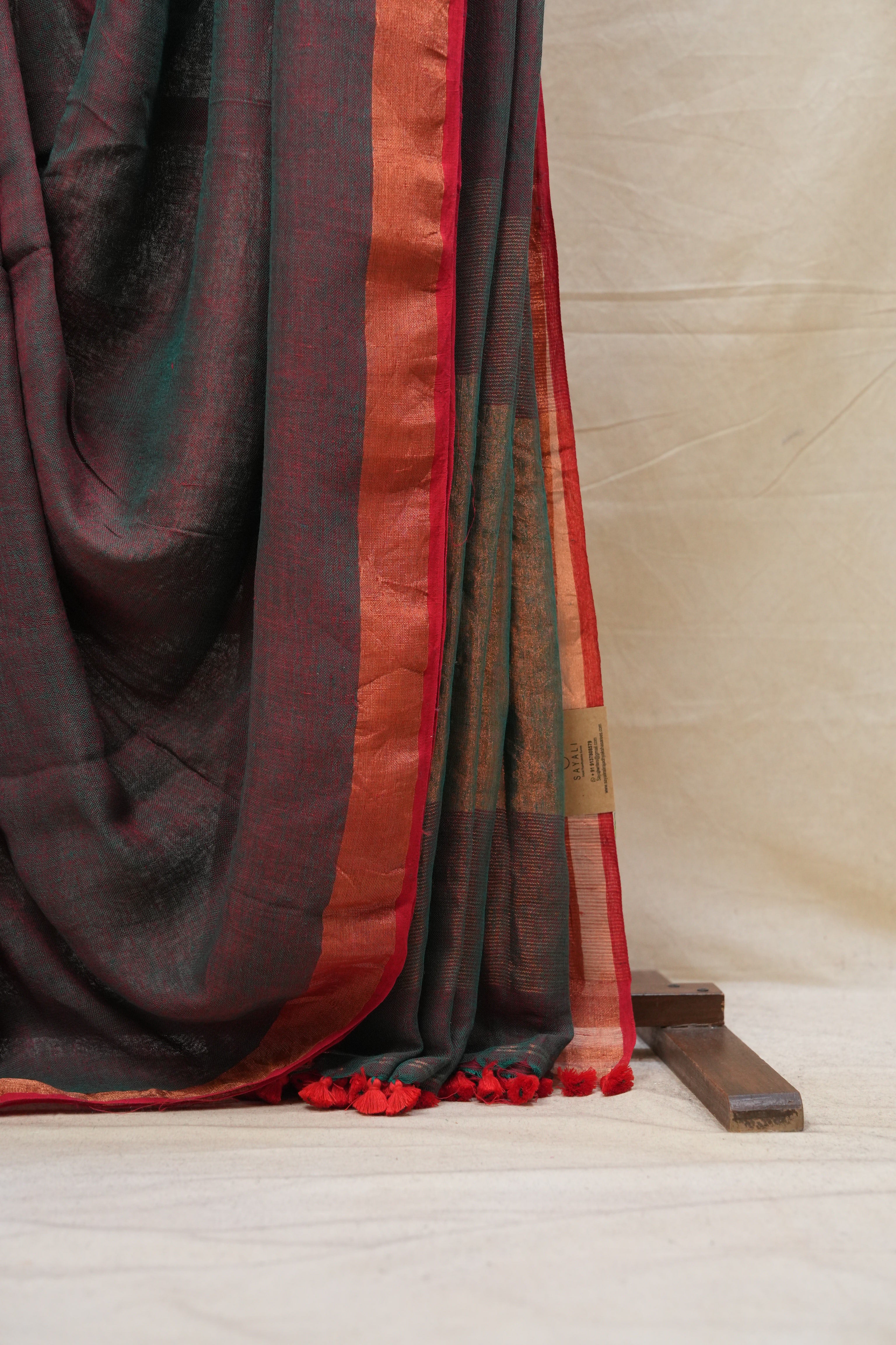 Green Plain Linen Saree With Pink Tassels - SRGPLS299