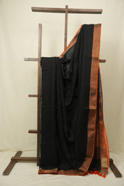 Black Plain Linen Saree With Orange Tassels - SRBPLS523