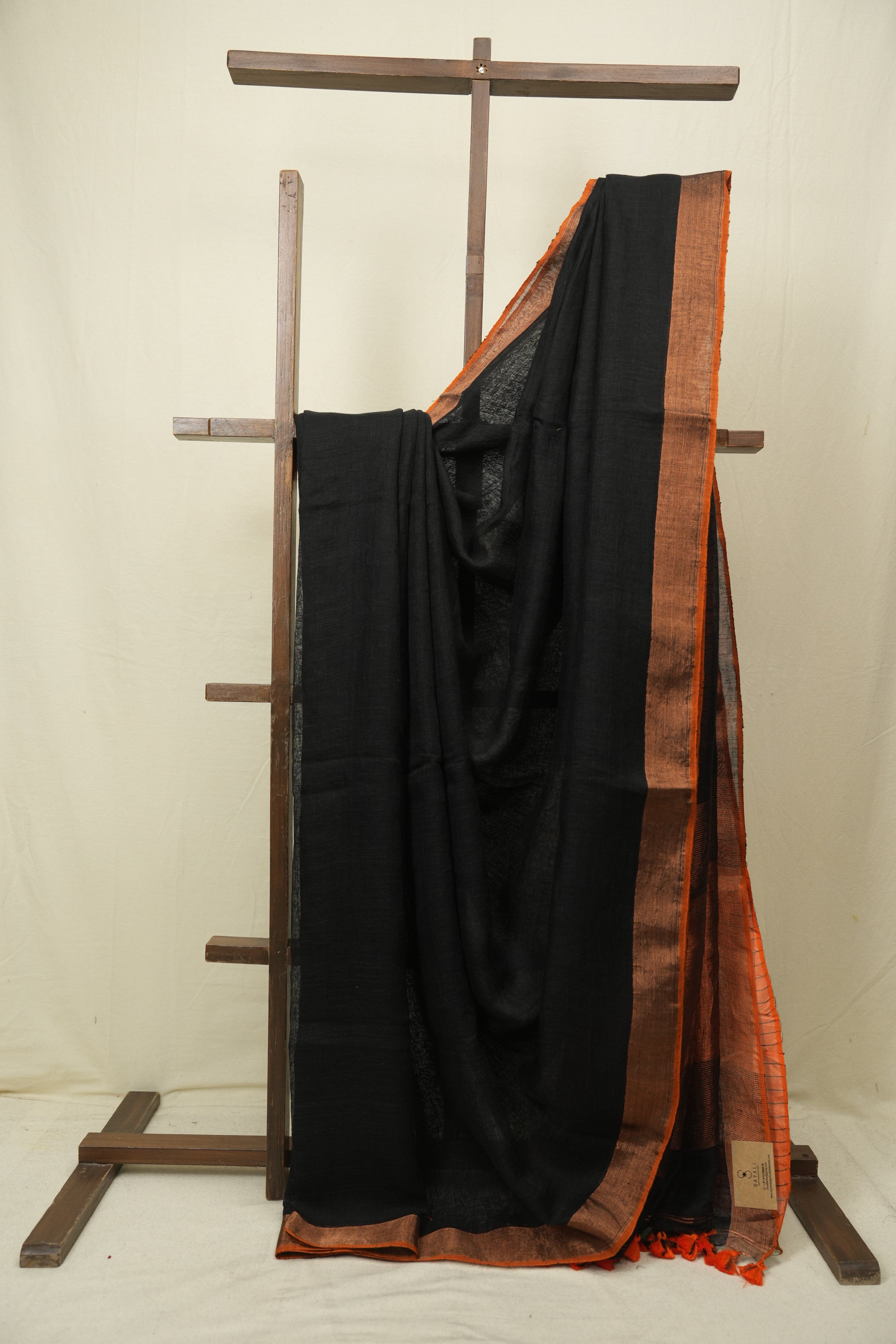 Black Plain Linen Saree With Orange Tassels - SRBPLS523