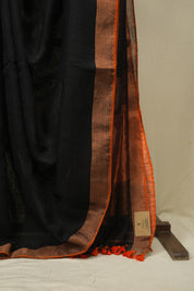 Black Plain Linen Saree With Orange Tassels - SRBPLS523