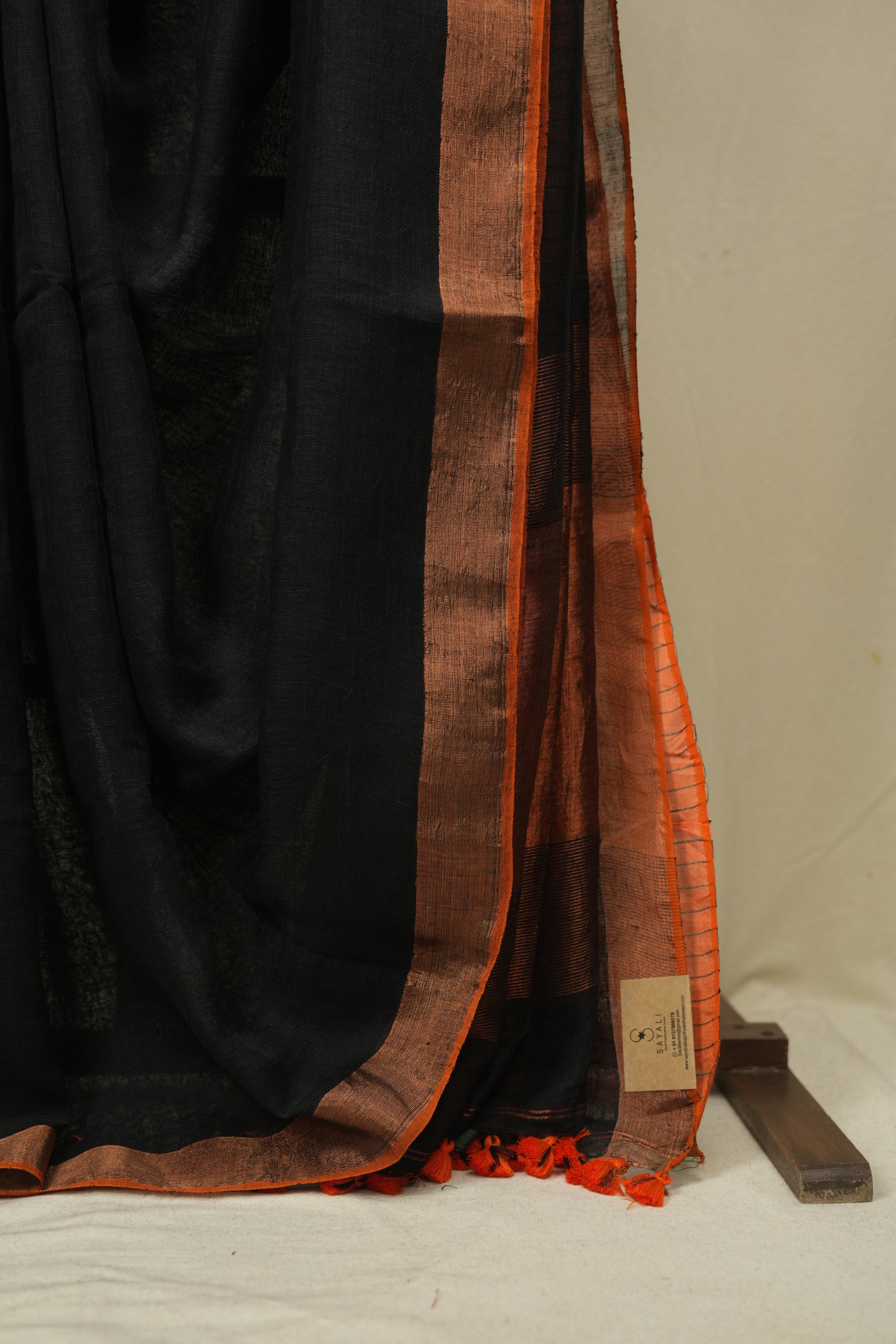 Black Plain Linen Saree With Orange Tassels - SRBPLS523