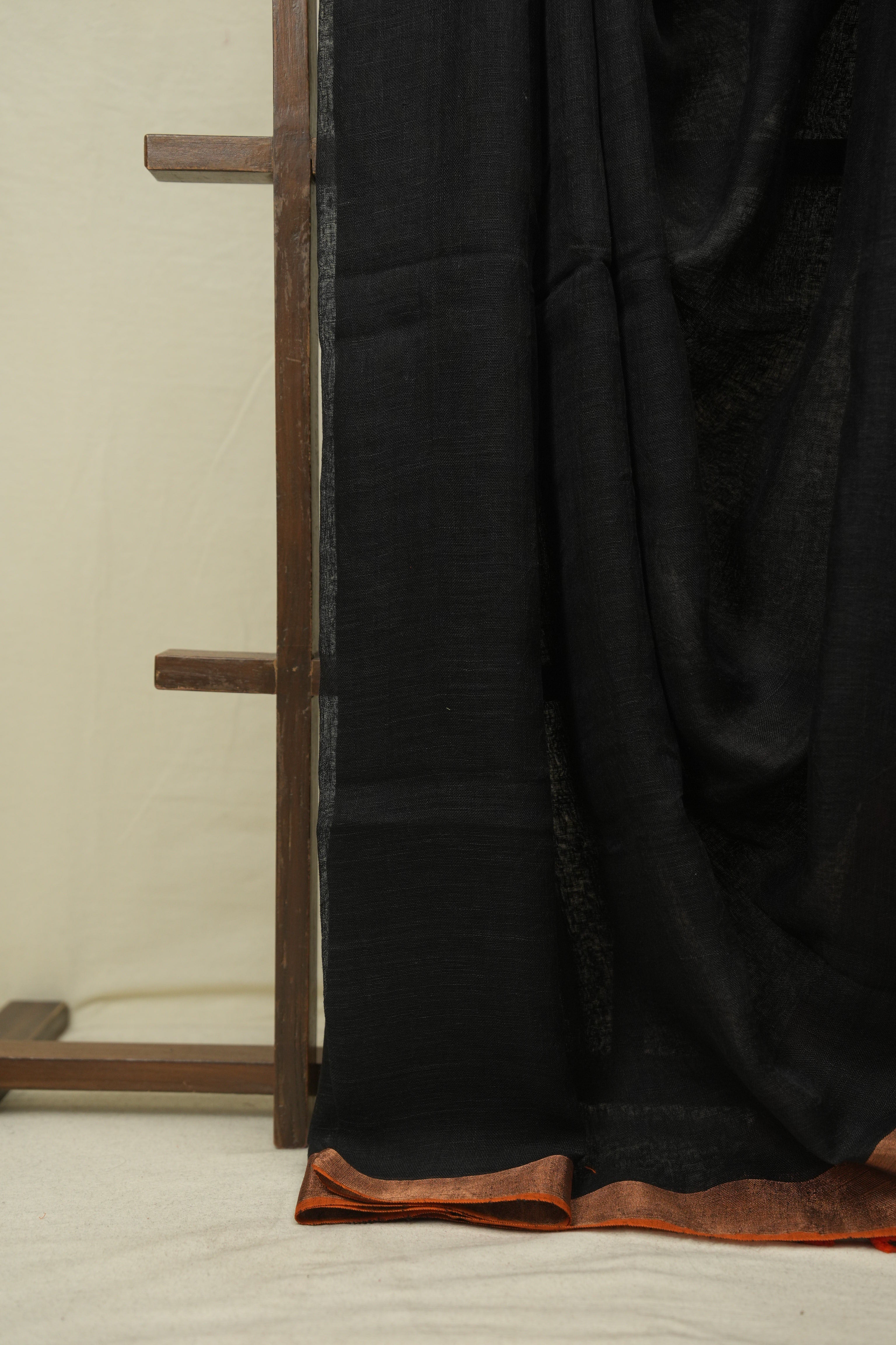 Black Plain Linen Saree With Orange Tassels - SRBPLS523