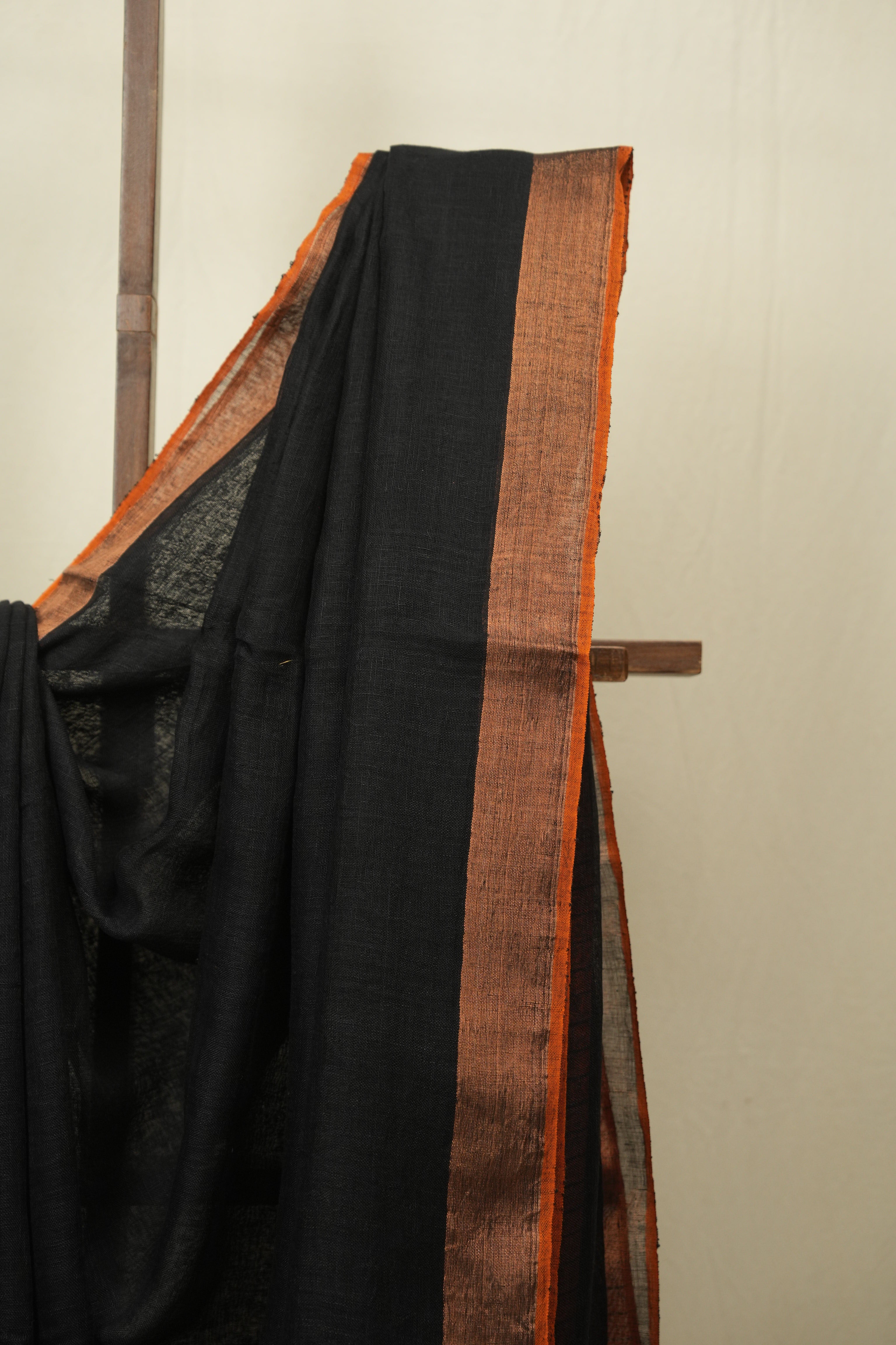 Black Plain Linen Saree With Orange Tassels - SRBPLS523