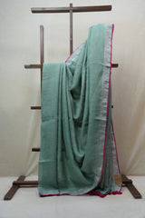 Light Green Plain Linen Saree With Pink Tassels - SRLGPLS276