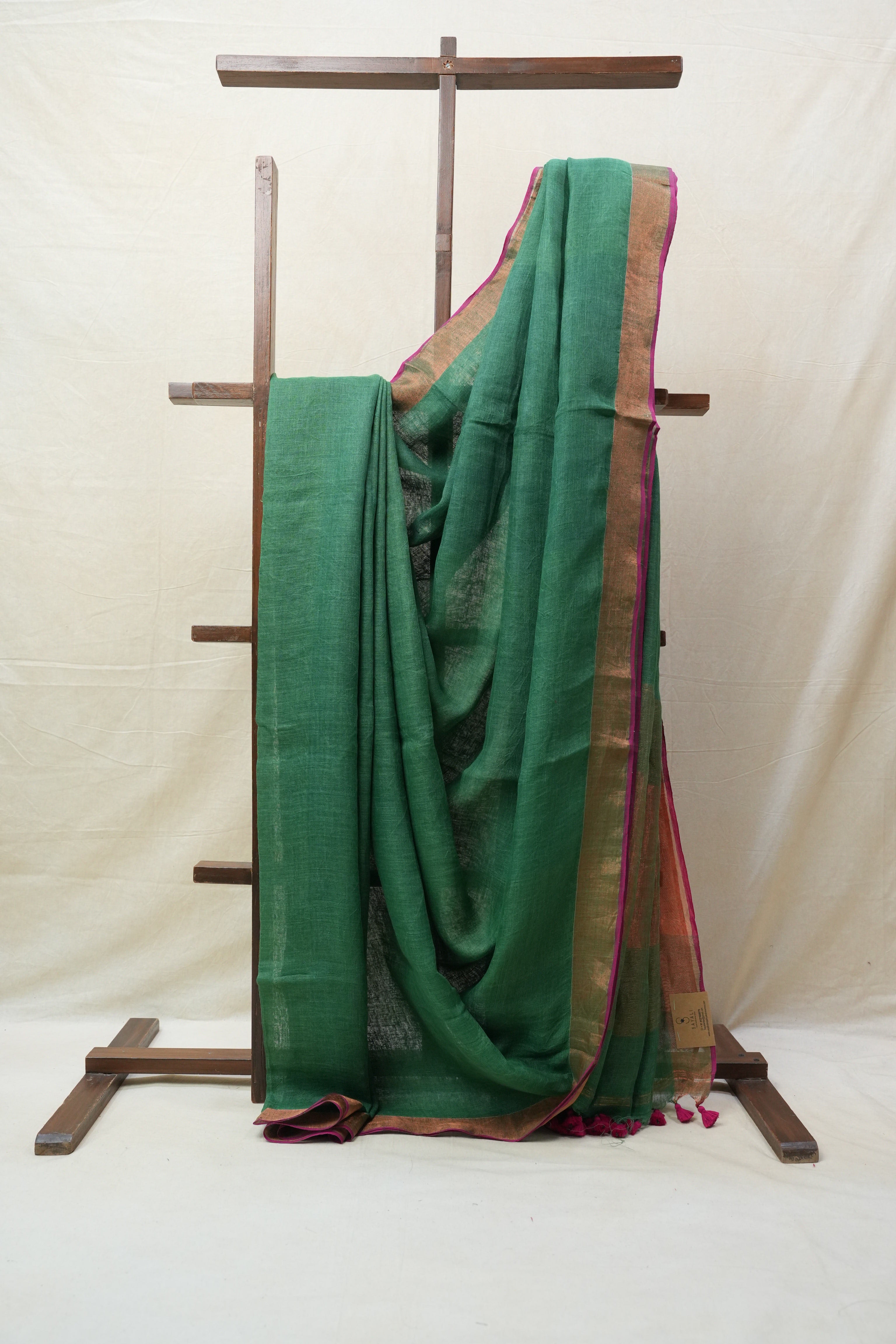 Green Plain Linen Saree With Pink Tassels - SRGPLS292