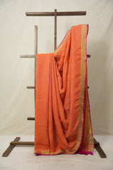 Orange Plain Linen Saree With Pink Tassels - SROPLS527