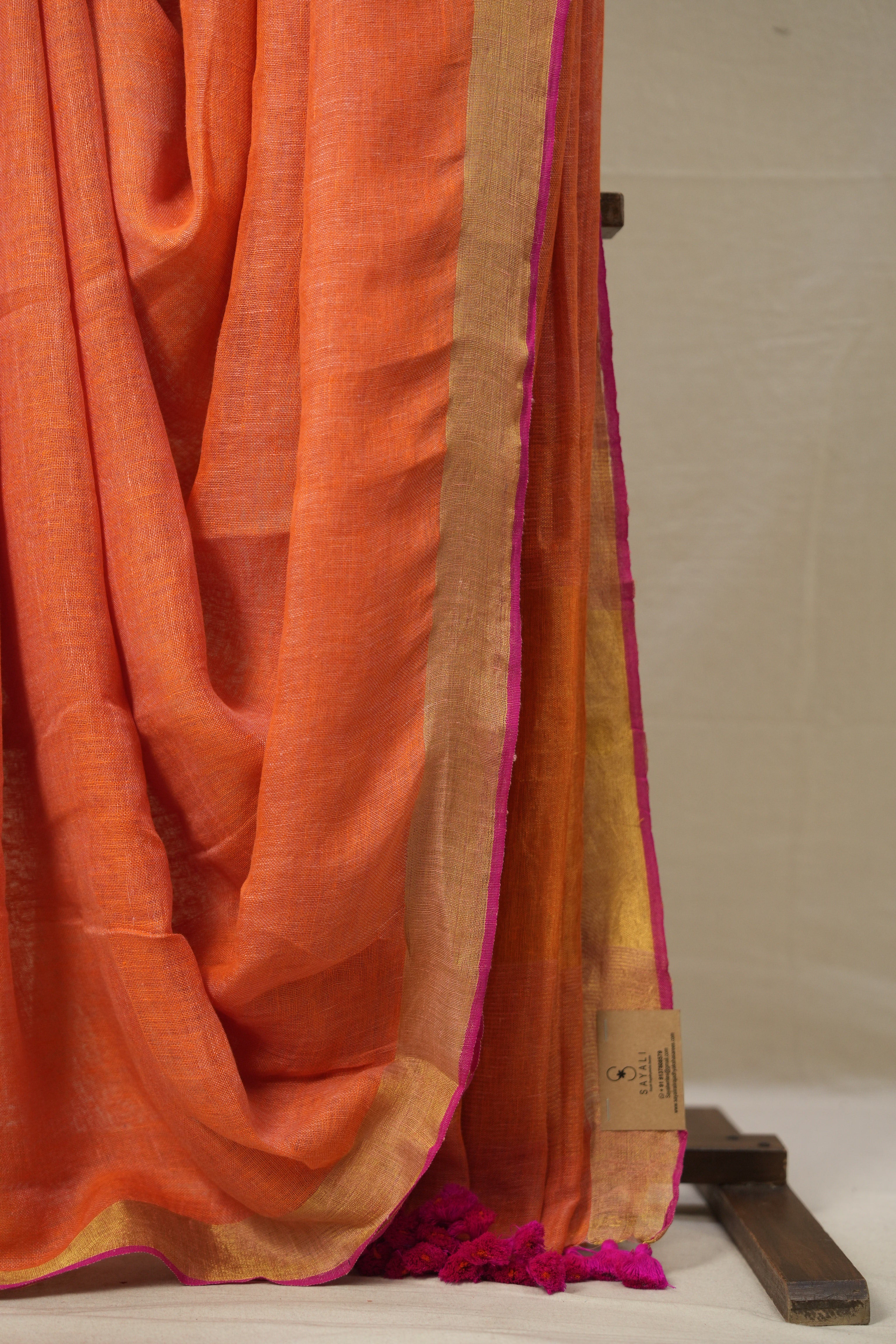 Orange Plain Linen Saree With Pink Tassels - SROPLS527