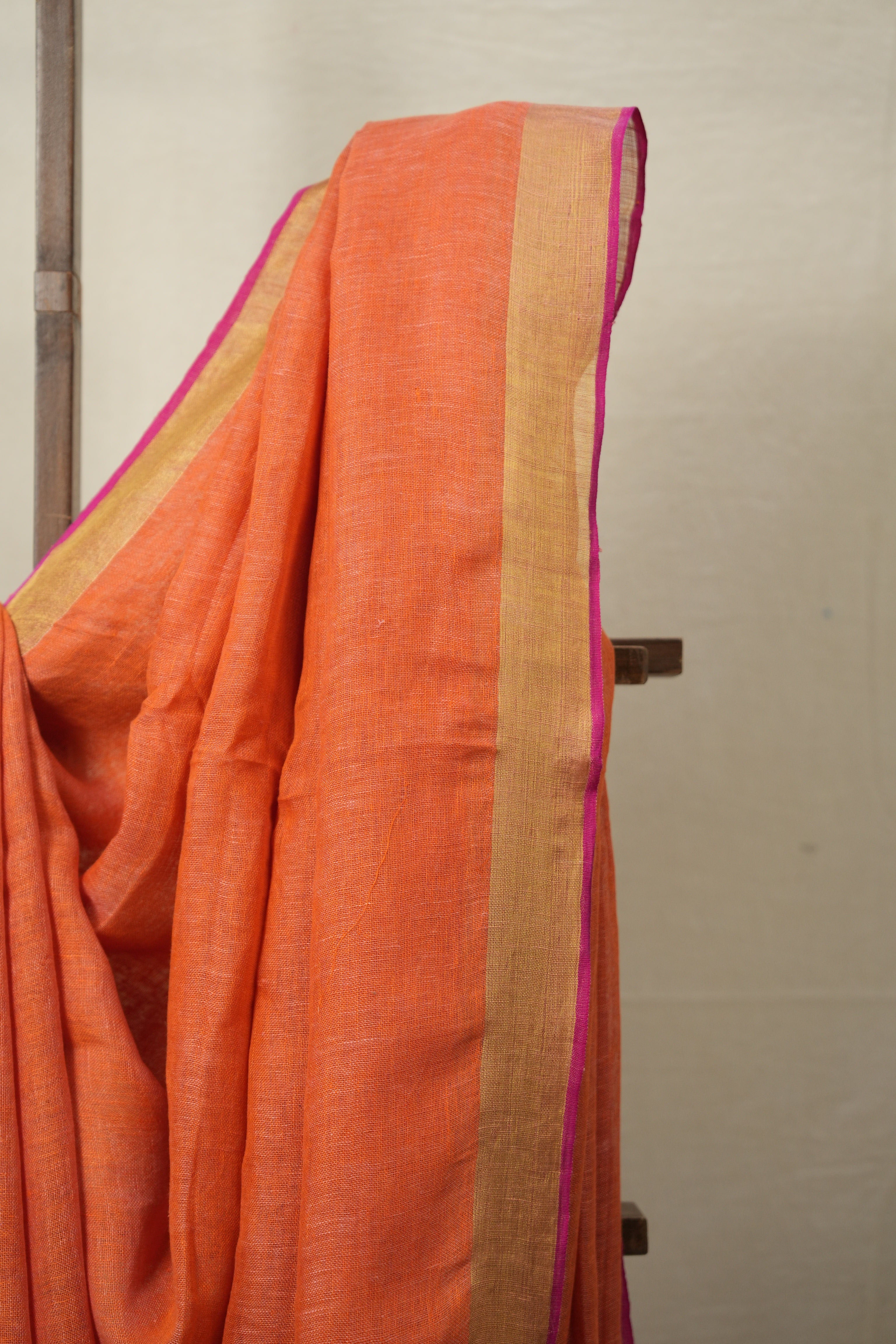 Orange Plain Linen Saree With Pink Tassels - SROPLS527