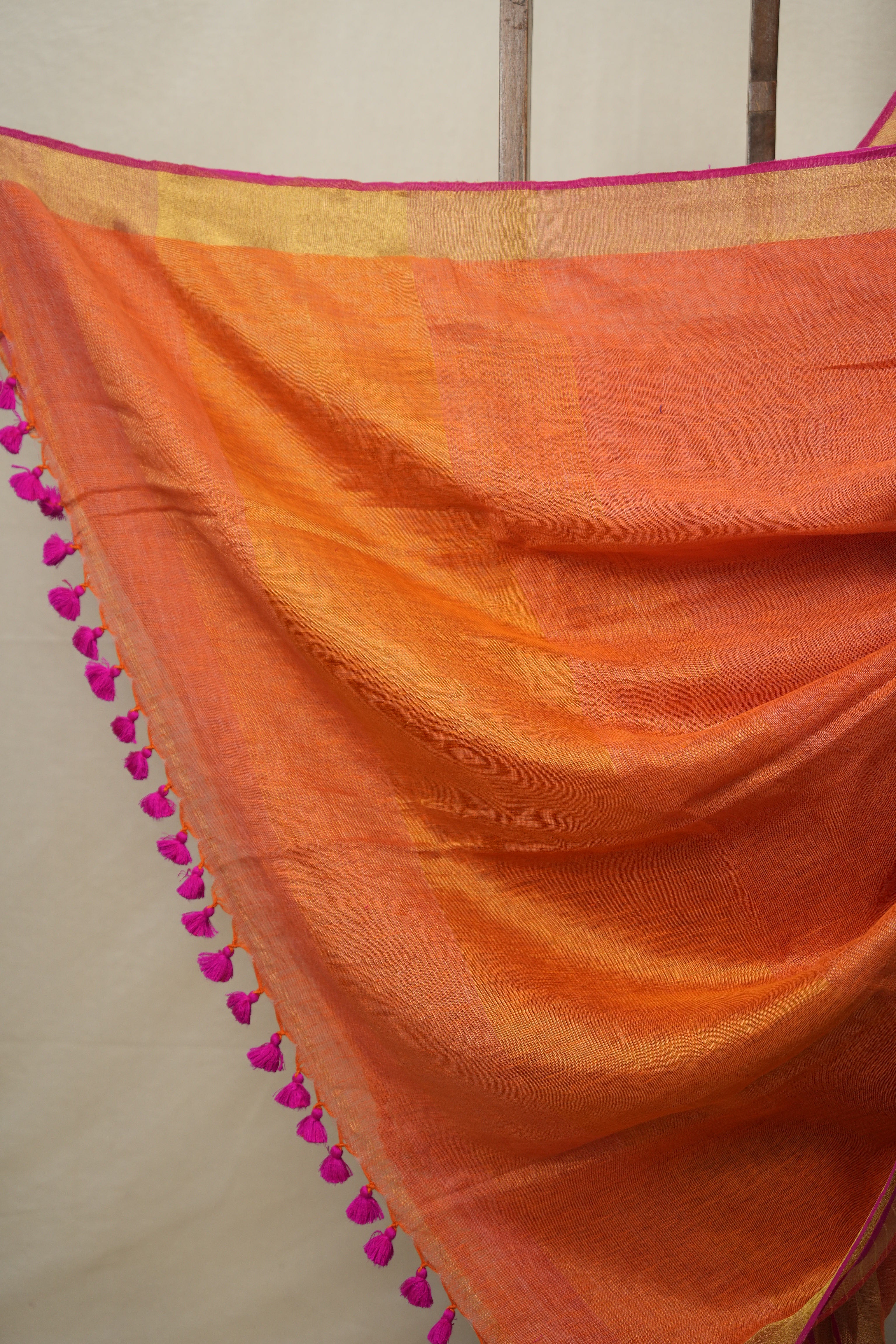 Orange Plain Linen Saree With Pink Tassels - SROPLS527