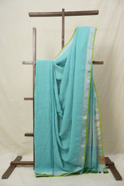 Aqua Plain Linen Saree With Parrot Green Tassels - SRAPLSWPGT344