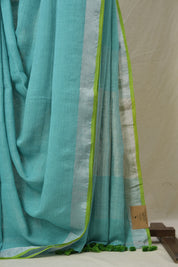 Aqua Plain Linen Saree With Parrot Green Tassels - SRAPLSWPGT344