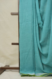 Aqua Plain Linen Saree With Parrot Green Tassels - SRAPLSWPGT344