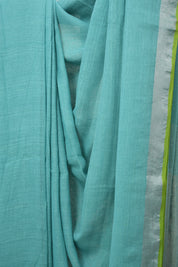 Aqua Plain Linen Saree With Parrot Green Tassels - SRAPLSWPGT344