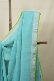 Aqua Plain Linen Saree With Parrot Green Tassels - SRAPLSWPGT344