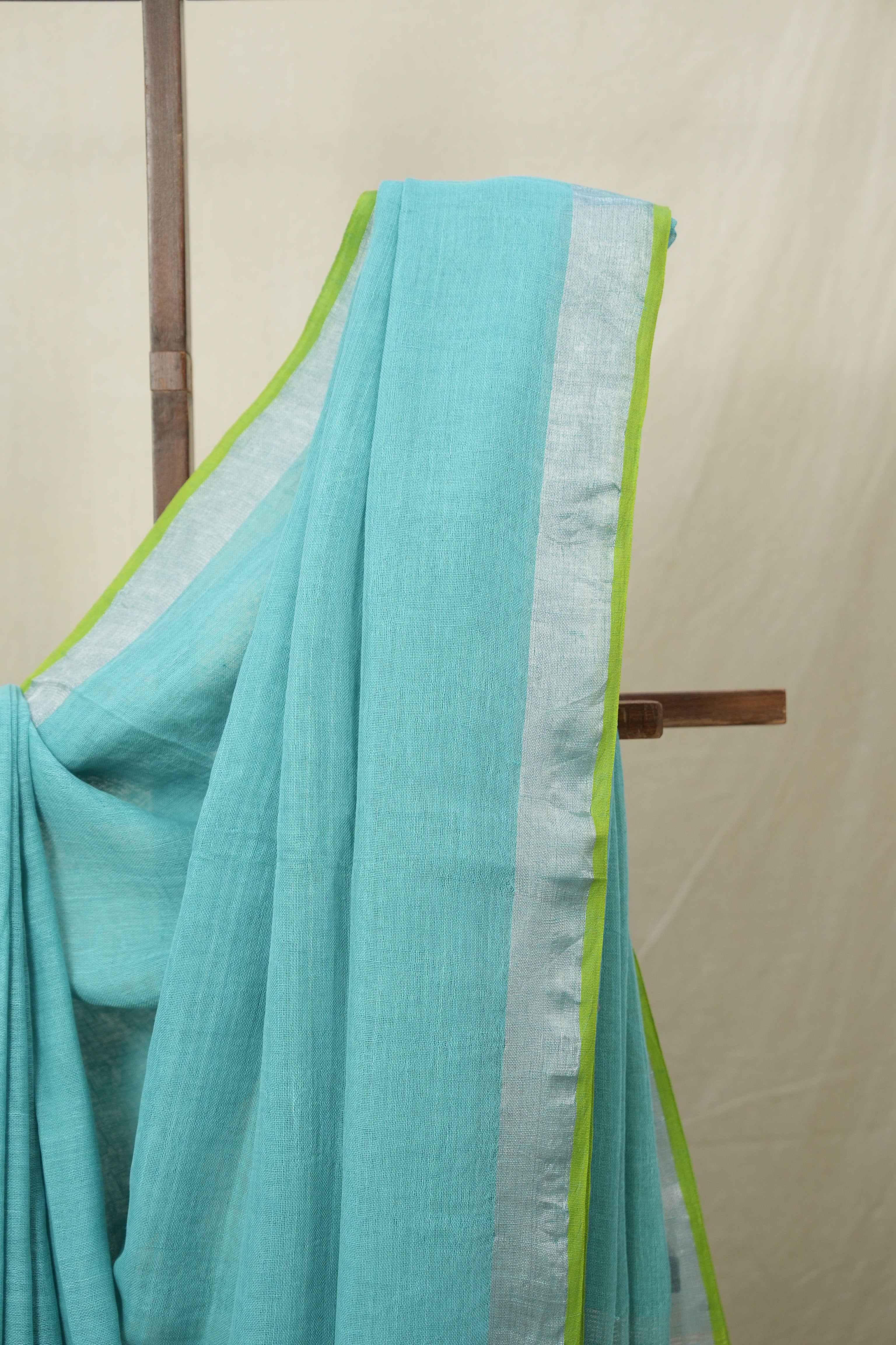 Aqua Plain Linen Saree With Parrot Green Tassels - SRAPLSWPGT344
