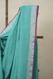 Aqua Plain Linen Saree With Pink Tassels -SRAPLS464