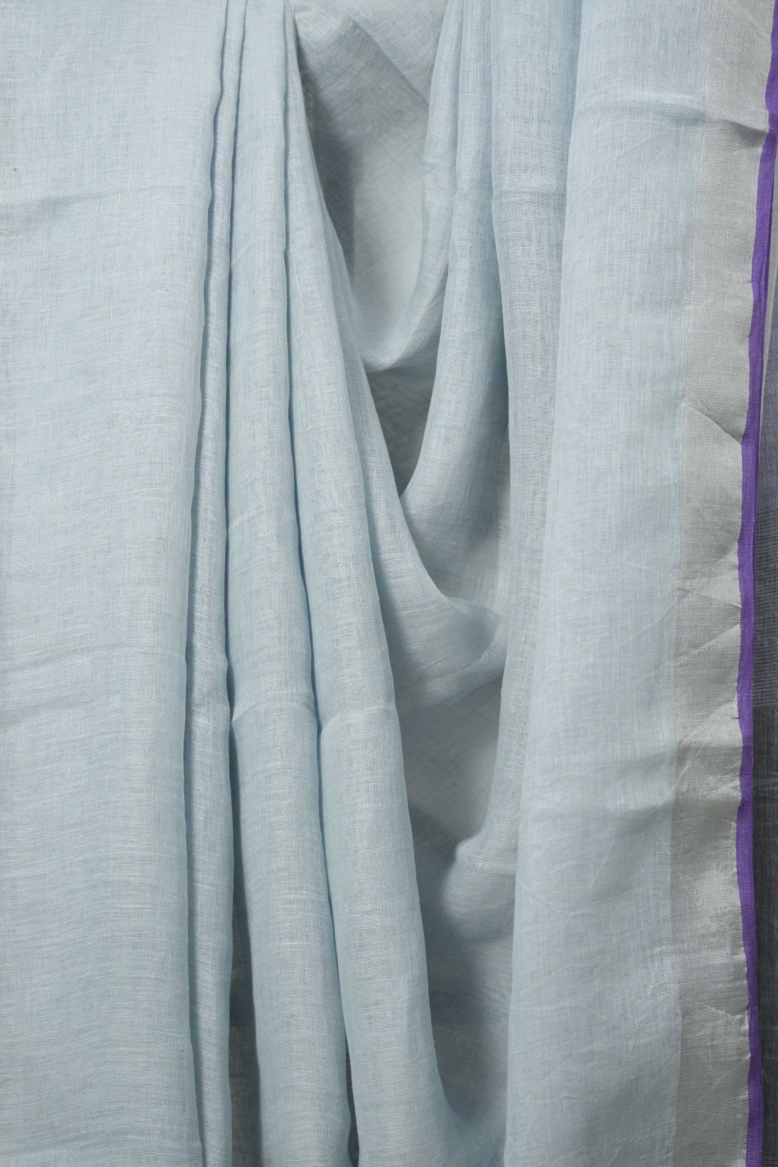 Pastel Sky Blue Plain Linen Saree With Purple Tassels -SRPSBPLS469