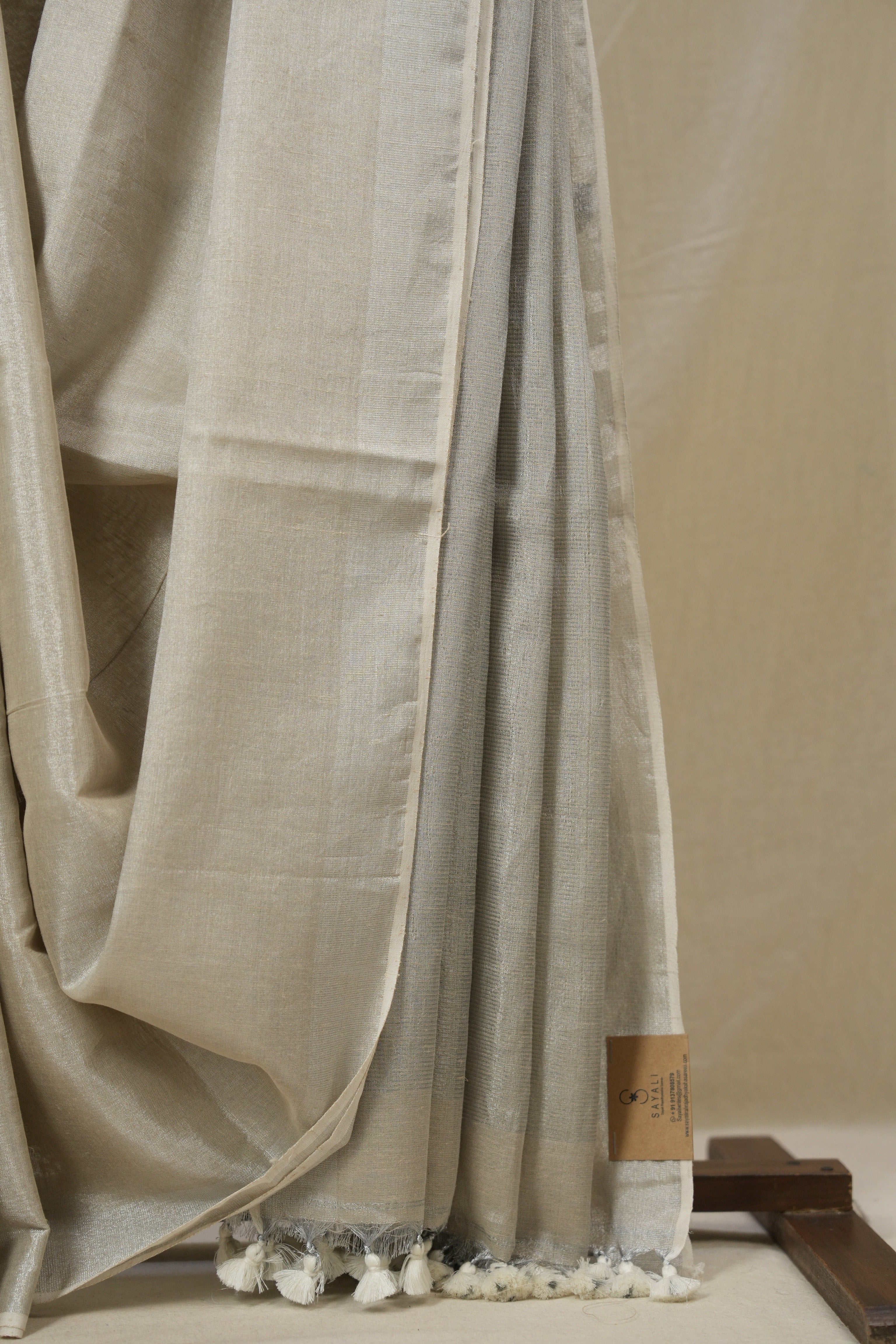 Ivory Plain Tissue Linen Saree With Tassels - SRIPTLS299