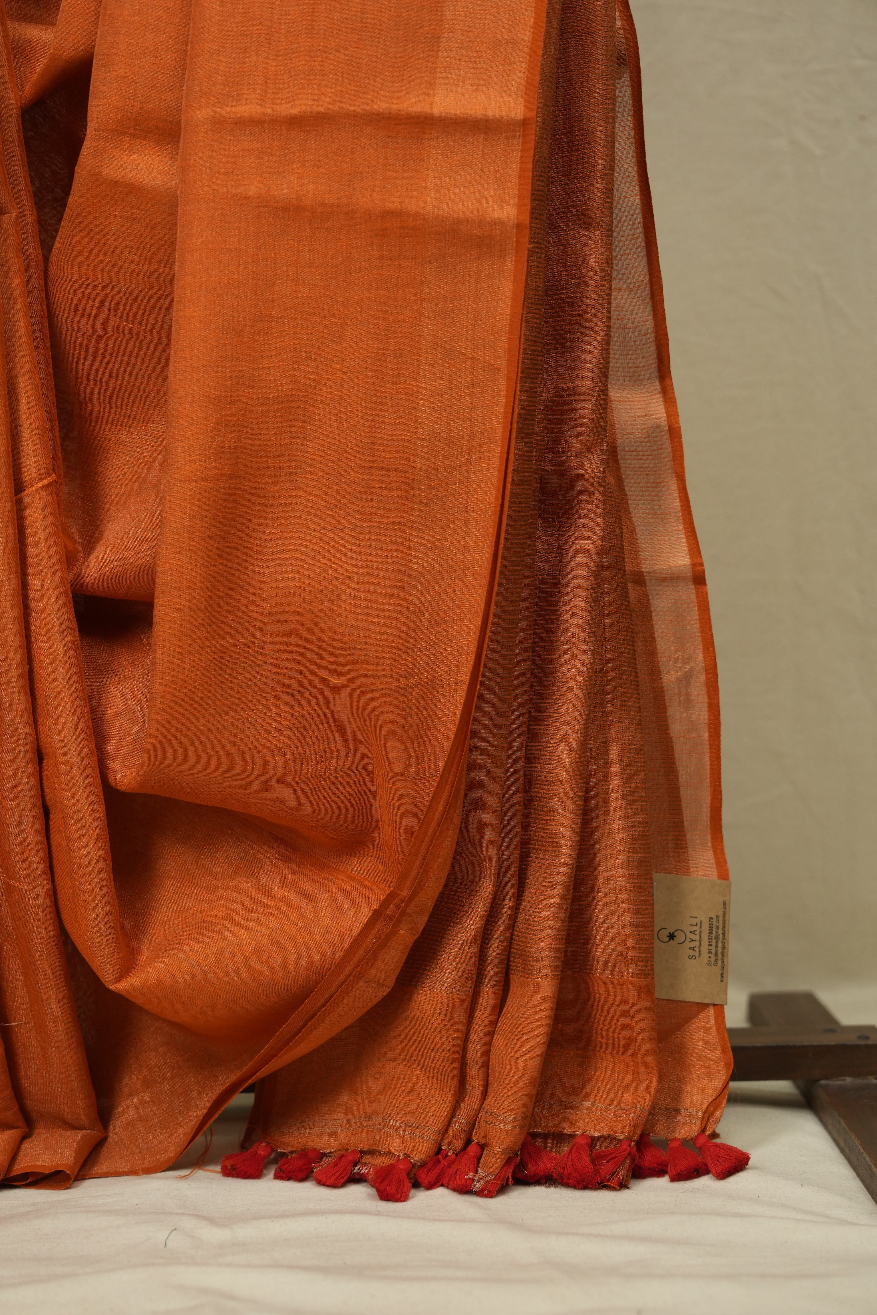 Orange Plain Tissue Linen Saree With Tassels - SROPTLS303