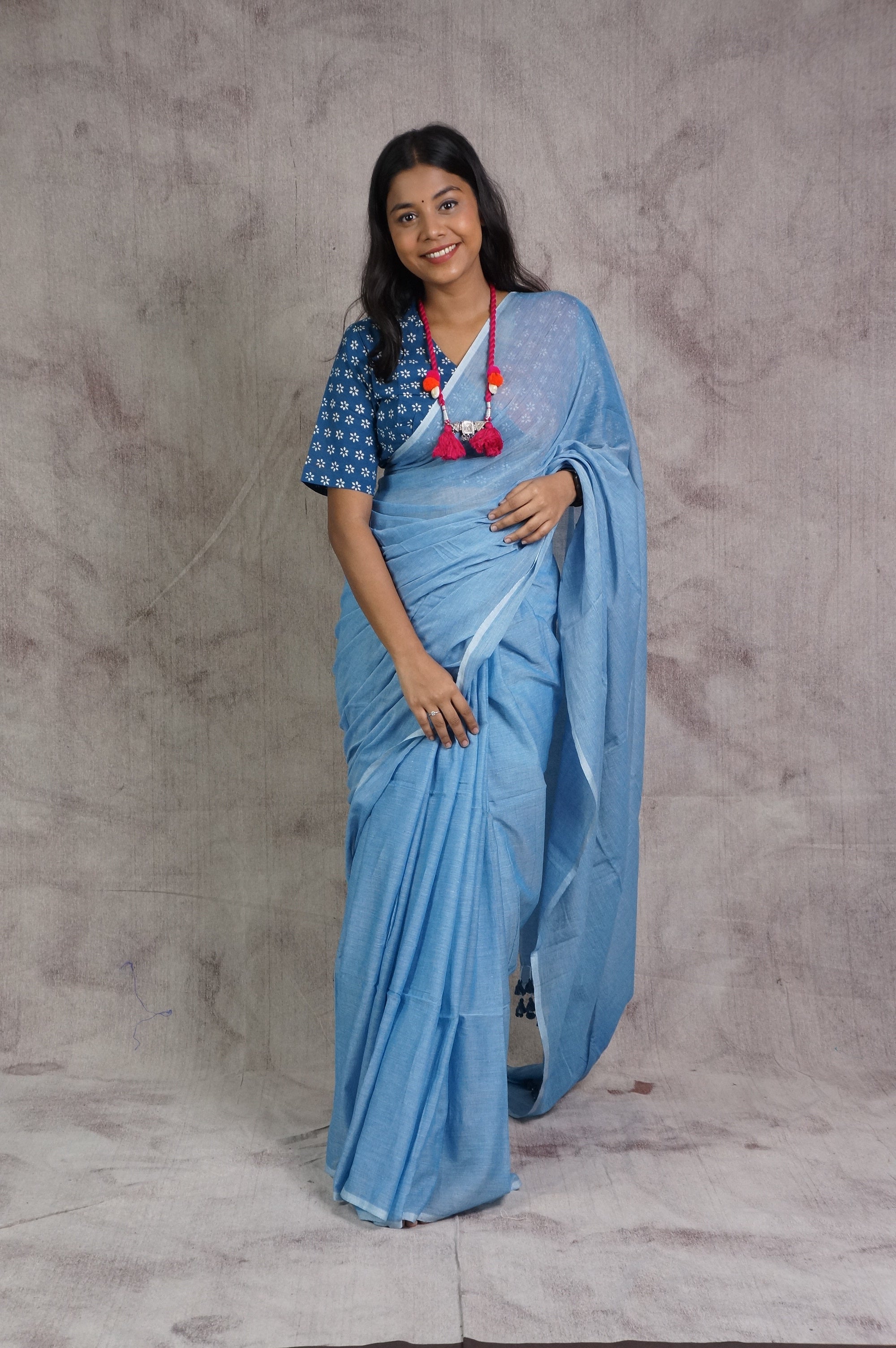 Powder Blue Mul Cotton Saree With Blue Tassels