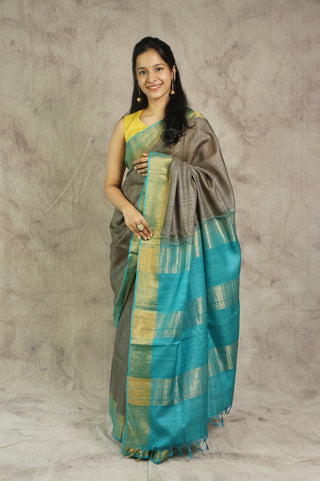 Plain Grey Tussar Silk Saree With Blue Golden Border